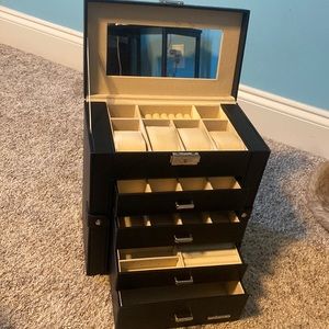Spacious black jewelry box.